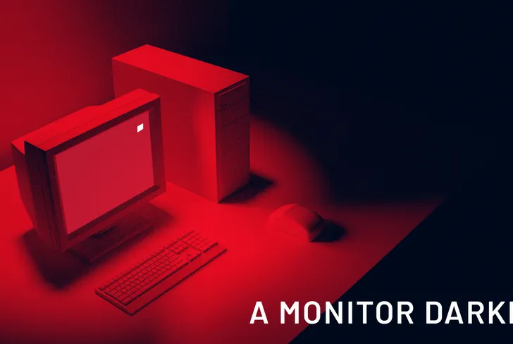 A Monitor Darkly research thumbnail showing a desk and monitor in red light