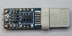 Lightning connector board with a blue solder mask and exposed components