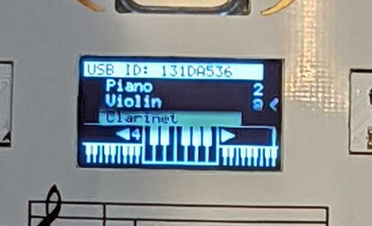Badge LCD showing the note information display listing piano, violin and clarinet